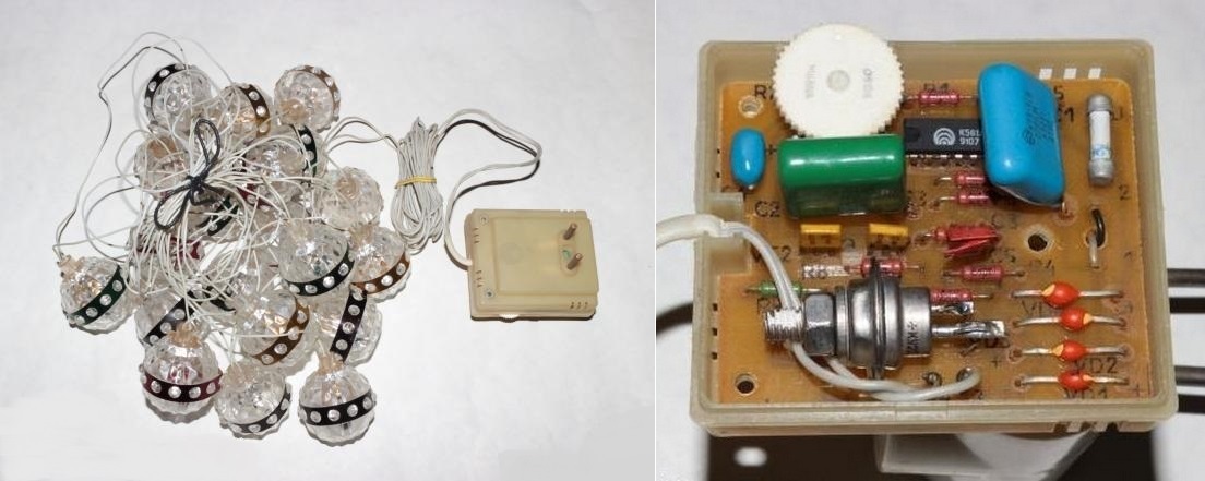 Фото 2.7. Более современная гирлянда с внешним мигательным блоком-вилкой. «Зимняя фантазия» завода «Телемеханика», 1991 г. В фонариках всё те же Е13.5-0.16 с цоколями Е10, внешний блок выполнен уже на основе логической микросхемы К561ЛН2, ключевой элемент — тиристор КУ202М. Переменный резистор — подобный тем, что применялись в карманных радиоприёмниках, в одном из крайних положений он выключается, тогда гирлянда светится постоянно